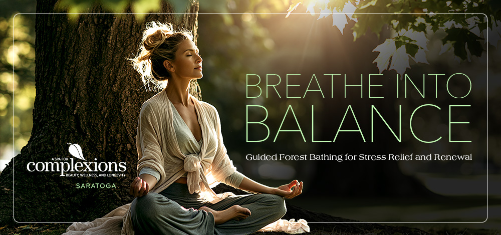 Beautiful woman sitting in the park forest bathing next to a tree